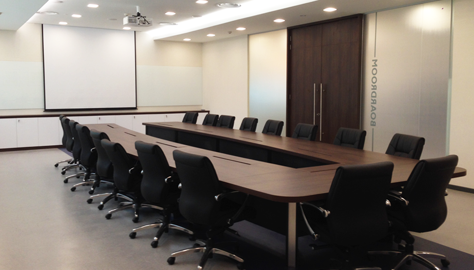 board room design with meeting table and overhead projector